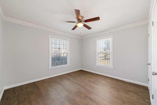 spare room with ornamental molding, dark hardwood / wood-style flooring, and a healthy amount of sunlight