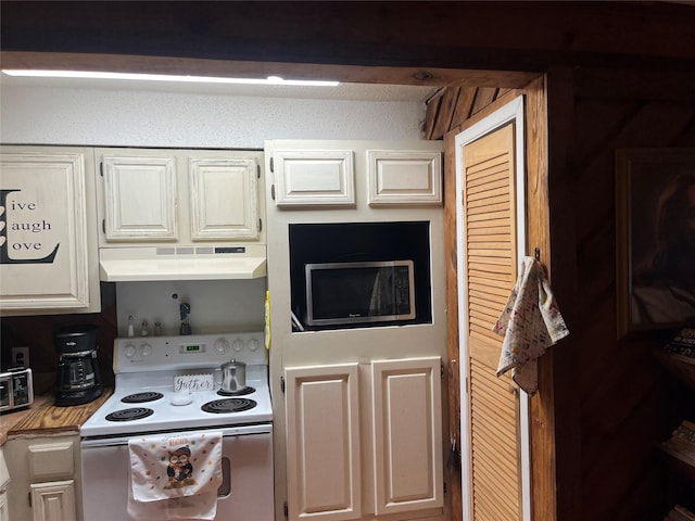 kitchen with white cabinetry, white range with electric cooktop, and exhaust hood