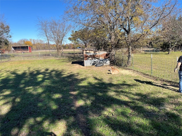 view of yard with a rural view