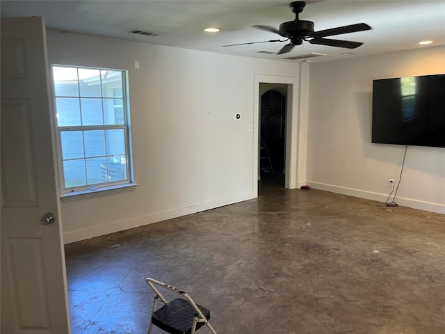 unfurnished living room with ceiling fan and plenty of natural light