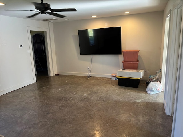 unfurnished living room featuring ceiling fan