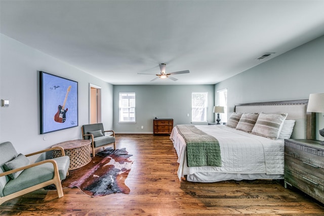 bedroom featuring dark hardwood / wood-style flooring and ceiling fan