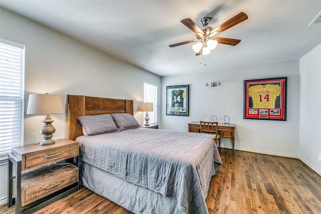 bedroom featuring ceiling fan and dark hardwood / wood-style floors