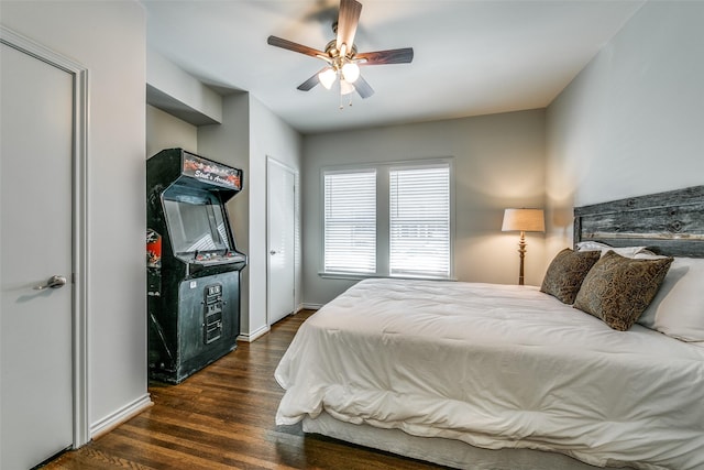 bedroom featuring ceiling fan and dark wood-type flooring