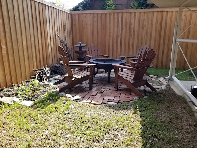 view of yard with a patio and an outdoor fire pit