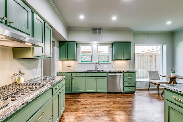 kitchen featuring green cabinets, sink, light hardwood / wood-style floors, and stainless steel appliances