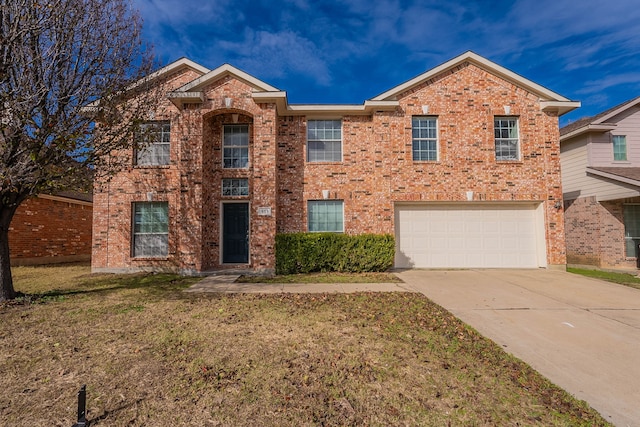 view of front of house with a garage and a front yard