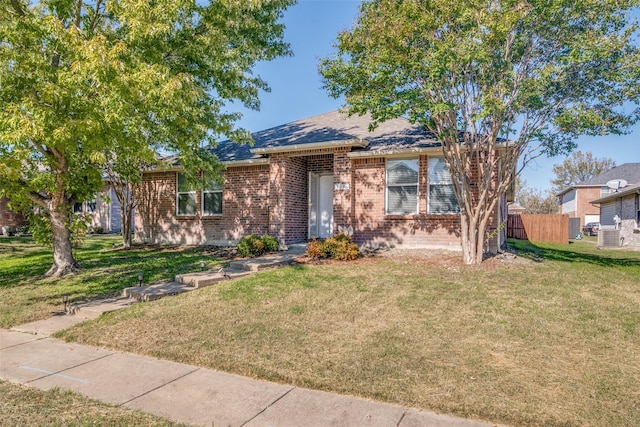 ranch-style home with a front yard