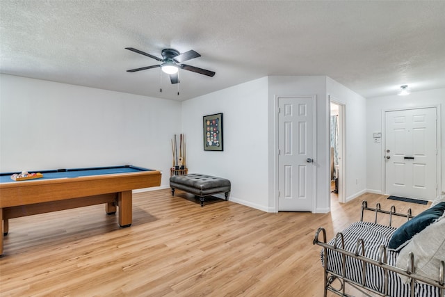 rec room featuring a textured ceiling, light hardwood / wood-style flooring, and pool table