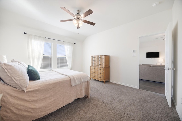 bedroom with carpet floors, lofted ceiling, ceiling fan, and baseboards