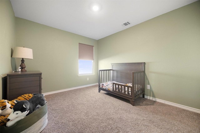 bedroom with baseboards, visible vents, and carpet flooring