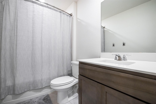 bathroom with tile patterned flooring, shower / bathtub combination with curtain, vanity, and toilet