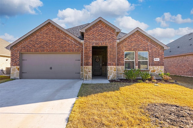 front of property featuring a front yard and a garage