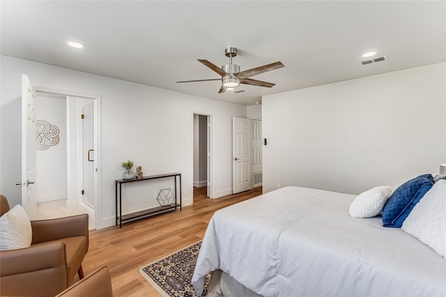 bedroom with hardwood / wood-style floors and ceiling fan