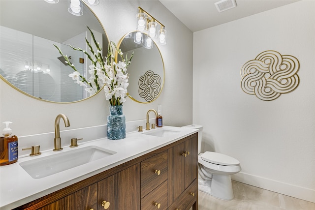 bathroom featuring tile patterned flooring, vanity, a shower, and toilet