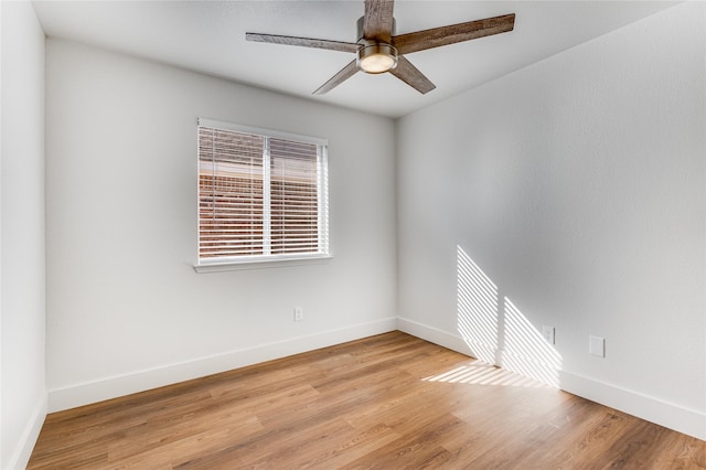 empty room featuring ceiling fan and light wood-type flooring