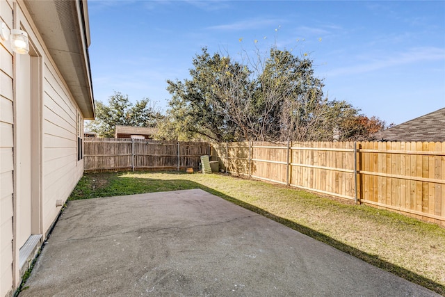 view of yard featuring a patio and a fenced backyard