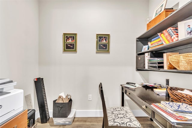 home office with wood-type flooring