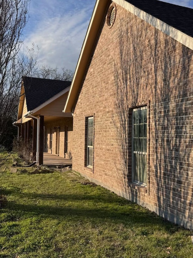 view of home's exterior with a lawn