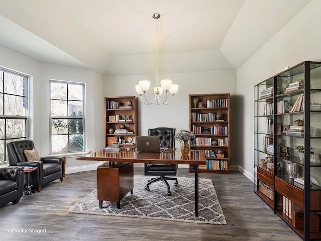 office space featuring dark hardwood / wood-style floors, vaulted ceiling, and a chandelier