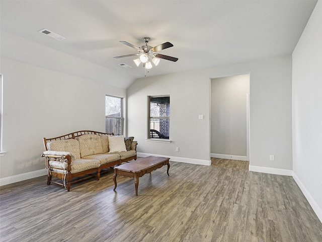 living room featuring hardwood / wood-style flooring, ceiling fan, and lofted ceiling