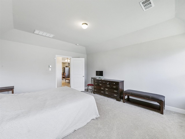 carpeted bedroom featuring lofted ceiling