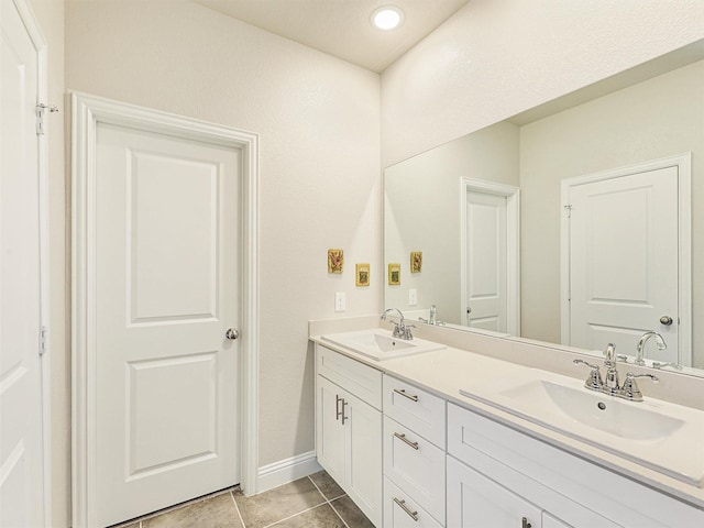 bathroom featuring tile patterned floors and vanity