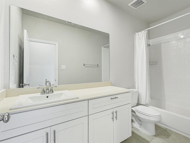 full bathroom with tile patterned flooring, shower / bath combo, vanity, and toilet