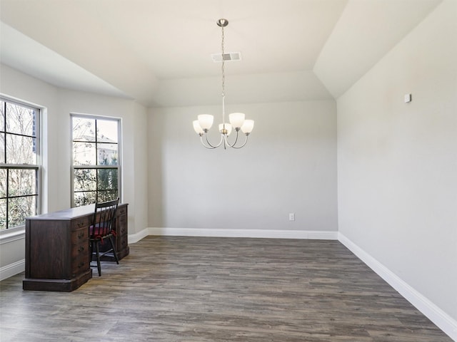 office space featuring a chandelier, dark wood-type flooring, and vaulted ceiling