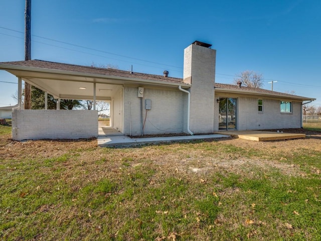 back of house with a yard