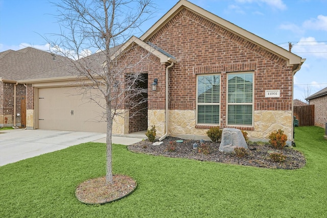 view of front of home featuring a garage and a front yard