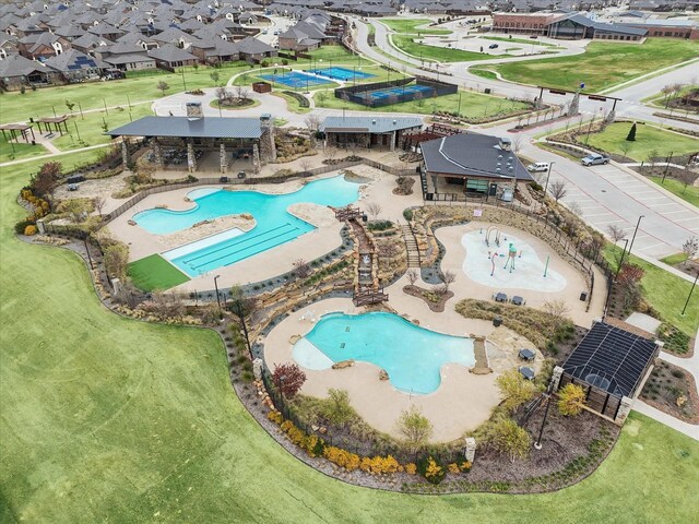 back of property featuring a playground, a patio area, and a yard