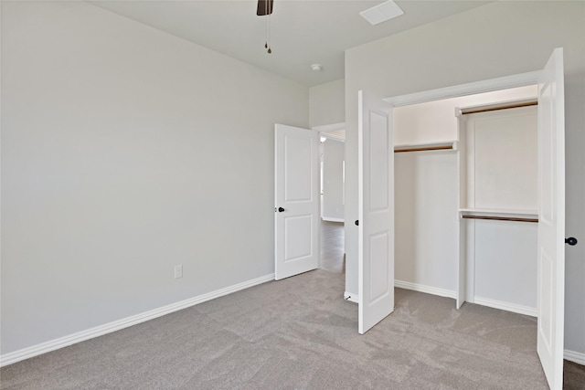 unfurnished bedroom with ceiling fan, a closet, and light colored carpet