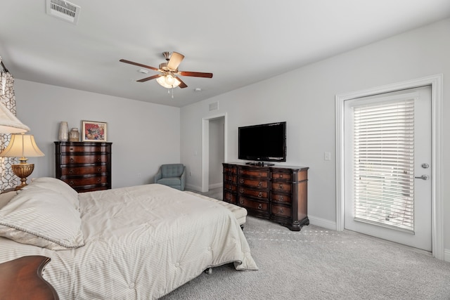 bedroom with multiple windows, ceiling fan, and light colored carpet