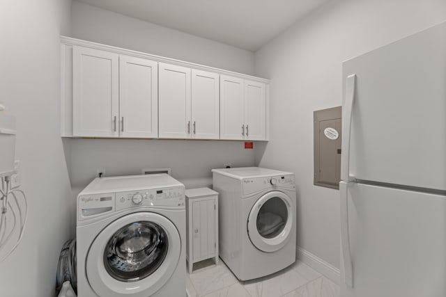 laundry room with cabinets and washing machine and dryer