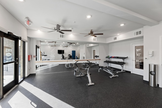 workout area with a wealth of natural light and ceiling fan