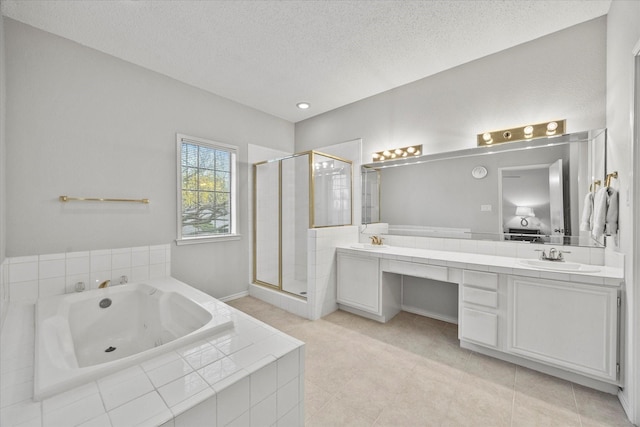 bathroom with vanity, a textured ceiling, and plus walk in shower