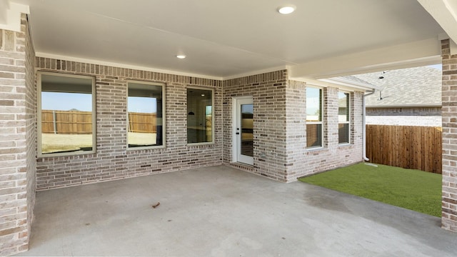 view of patio featuring fence