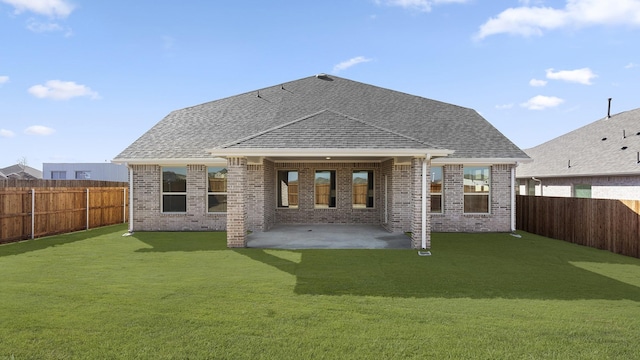 back of house with a patio, brick siding, roof with shingles, and a fenced backyard