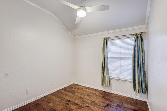 empty room with ceiling fan, dark hardwood / wood-style flooring, ornamental molding, and lofted ceiling