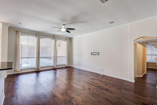 unfurnished room with dark hardwood / wood-style floors, ceiling fan, and crown molding