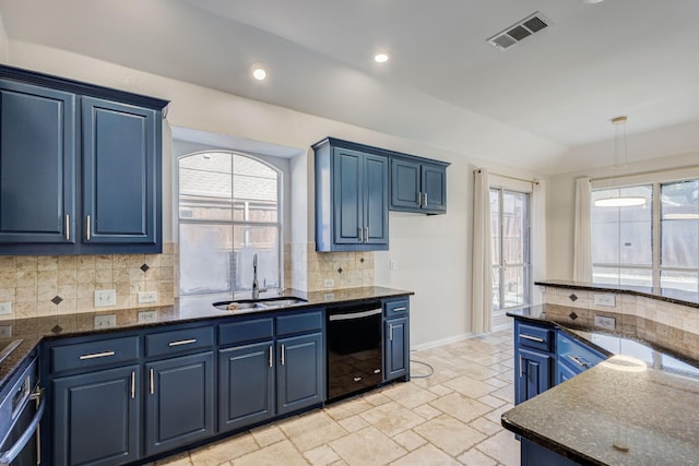 kitchen with blue cabinetry, dishwasher, sink, backsplash, and dark stone countertops