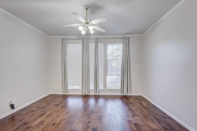 spare room featuring ceiling fan, dark hardwood / wood-style flooring, and crown molding