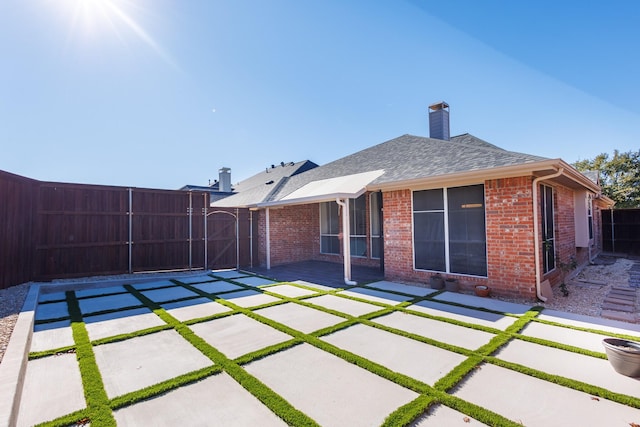 back of house with a patio area