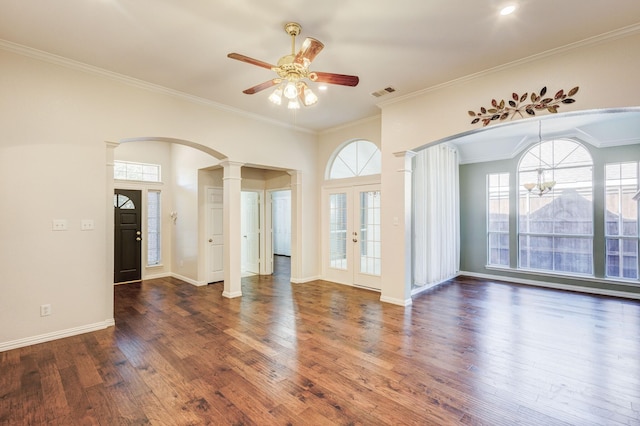 interior space featuring decorative columns, dark hardwood / wood-style floors, and crown molding