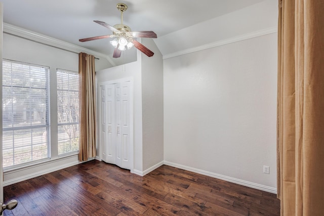 unfurnished bedroom with multiple windows, ceiling fan, crown molding, and dark hardwood / wood-style floors