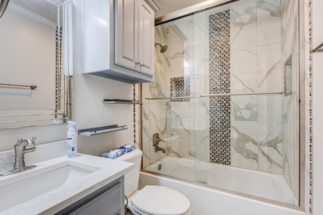 full bathroom with vanity, toilet, and enclosed tub / shower combo