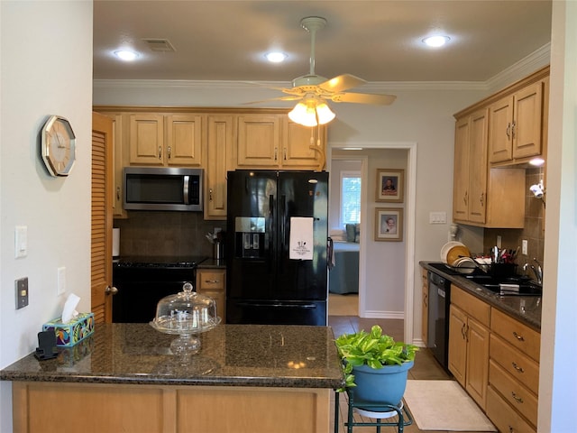 kitchen featuring tasteful backsplash, black appliances, sink, dark stone counters, and kitchen peninsula