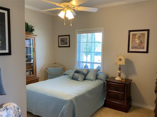 bedroom featuring light carpet, ornamental molding, and ceiling fan