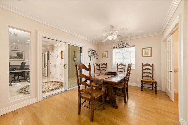 dining area with ceiling fan, light wood-type flooring, and ornamental molding